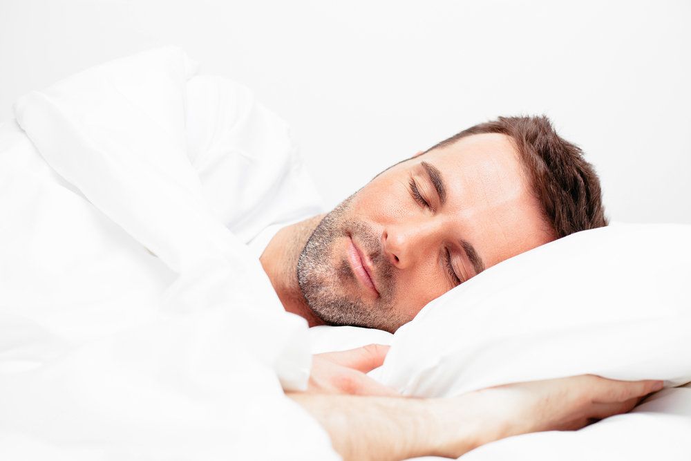 Man with stubble sleeping peacefully