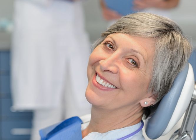 Relaxed middle-aged woman leaning back in exam chair